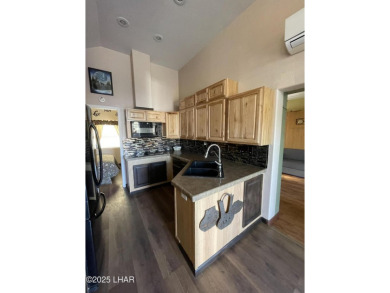 Beautiful park model has an addition added to it, giving you on The Refuge Golf and Country Club in Arizona - for sale on GolfHomes.com, golf home, golf lot