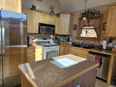 Welcome to this beautifully maintained 2-bedroom, 2-bathroom on Michaywe Pines Course in Michigan - for sale on GolfHomes.com, golf home, golf lot