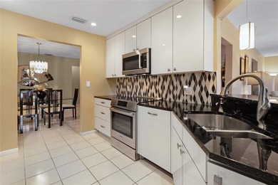 Welcome to the South Florida lifestyle.  Sweeping lake views on Deer Creek Golf Club in Florida - for sale on GolfHomes.com, golf home, golf lot