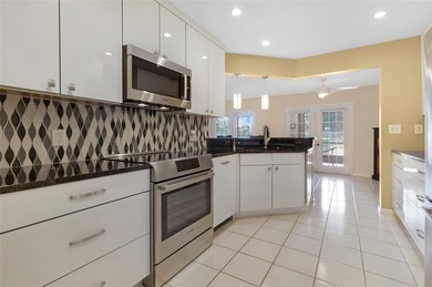 Welcome to the South Florida lifestyle.  Sweeping lake views on Deer Creek Golf Club in Florida - for sale on GolfHomes.com, golf home, golf lot