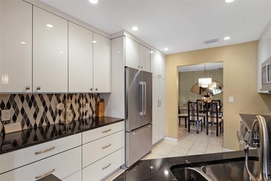 Welcome to the South Florida lifestyle.  Sweeping lake views on Deer Creek Golf Club in Florida - for sale on GolfHomes.com, golf home, golf lot