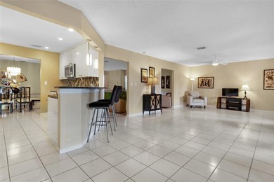 Welcome to the South Florida lifestyle.  Sweeping lake views on Deer Creek Golf Club in Florida - for sale on GolfHomes.com, golf home, golf lot