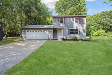 Step into tranquility w/ this stunning 3-bedroom, 1.5-bath home on Lake Monterey Golf Club in Michigan - for sale on GolfHomes.com, golf home, golf lot