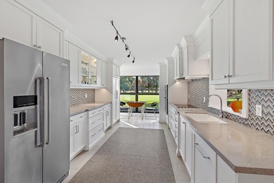 Experience effortless luxury and serene golf course views on the on Jonathans Landing Golf Club in Florida - for sale on GolfHomes.com, golf home, golf lot