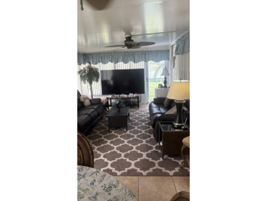 Spacious 3-Bedroom Palm Harbor with Golf Cart in 55+ on Sabal Springs Golf and Racquet Club in Florida - for sale on GolfHomes.com, golf home, golf lot