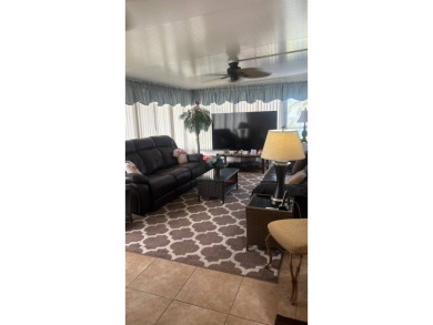 Spacious 3-Bedroom Palm Harbor with Golf Cart in 55+ on Sabal Springs Golf and Racquet Club in Florida - for sale on GolfHomes.com, golf home, golf lot