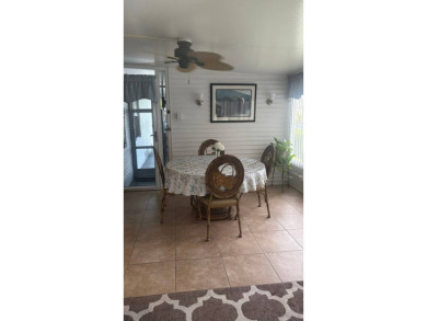 Spacious 3-Bedroom Palm Harbor with Golf Cart in 55+ on Sabal Springs Golf and Racquet Club in Florida - for sale on GolfHomes.com, golf home, golf lot