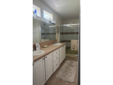 Spacious 3-Bedroom Palm Harbor with Golf Cart in 55+ on Sabal Springs Golf and Racquet Club in Florida - for sale on GolfHomes.com, golf home, golf lot