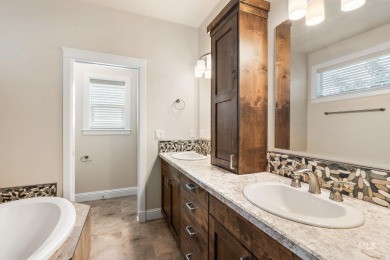 Spacious and thoughtfully designed, this 4-bedroom, 3.5-bath on Hunters Point Golf Club in Idaho - for sale on GolfHomes.com, golf home, golf lot