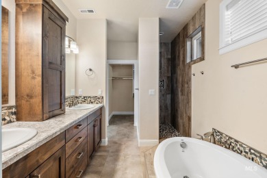 Spacious and thoughtfully designed, this 4-bedroom, 3.5-bath on Hunters Point Golf Club in Idaho - for sale on GolfHomes.com, golf home, golf lot