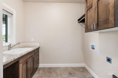 Spacious and thoughtfully designed, this 4-bedroom, 3.5-bath on Hunters Point Golf Club in Idaho - for sale on GolfHomes.com, golf home, golf lot