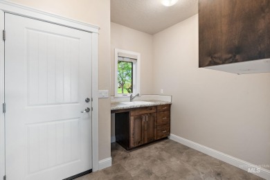 Spacious and thoughtfully designed, this 4-bedroom, 3.5-bath on Hunters Point Golf Club in Idaho - for sale on GolfHomes.com, golf home, golf lot