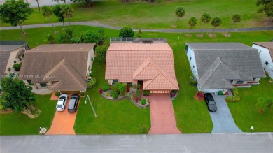 YOU MUST SEE THIS HOME TO APPRECIATE IT! BEAUTIFUL 3 BEDROOM / 2 on Woodmont Country Club in Florida - for sale on GolfHomes.com, golf home, golf lot