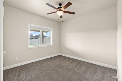 Spacious and thoughtfully designed, this 4-bedroom, 3.5-bath on Hunters Point Golf Club in Idaho - for sale on GolfHomes.com, golf home, golf lot