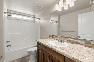Spacious and thoughtfully designed, this 4-bedroom, 3.5-bath on Hunters Point Golf Club in Idaho - for sale on GolfHomes.com, golf home, golf lot