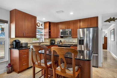 Thoughtfully updated end-unit residence in the desirable on Mangrove Bay Golf Course in Florida - for sale on GolfHomes.com, golf home, golf lot