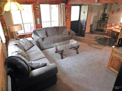 Among the serene wooded pines, this cozy, rustic cabin is a on Terrace Lakes Golf Resort in Idaho - for sale on GolfHomes.com, golf home, golf lot