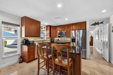 Thoughtfully updated end-unit residence in the desirable on Mangrove Bay Golf Course in Florida - for sale on GolfHomes.com, golf home, golf lot