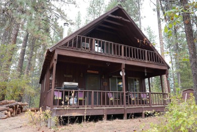Among the serene wooded pines, this cozy, rustic cabin is a on Terrace Lakes Golf Resort in Idaho - for sale on GolfHomes.com, golf home, golf lot