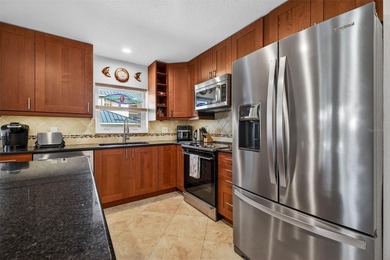 Thoughtfully updated end-unit residence in the desirable on Mangrove Bay Golf Course in Florida - for sale on GolfHomes.com, golf home, golf lot