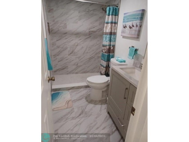Charming 2 Bedroom /2 Bath Lake View Condominium. Modern kitchen on Sunrise Lakes Phase III in Florida - for sale on GolfHomes.com, golf home, golf lot