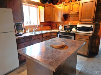 Among the serene wooded pines, this cozy, rustic cabin is a on Terrace Lakes Golf Resort in Idaho - for sale on GolfHomes.com, golf home, golf lot