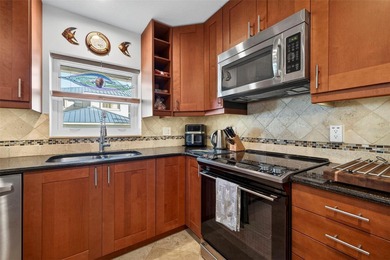 Thoughtfully updated end-unit residence in the desirable on Mangrove Bay Golf Course in Florida - for sale on GolfHomes.com, golf home, golf lot