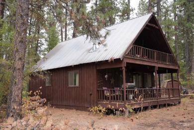 Among the serene wooded pines, this cozy, rustic cabin is a on Terrace Lakes Golf Resort in Idaho - for sale on GolfHomes.com, golf home, golf lot