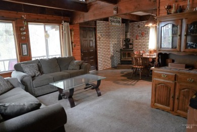 Among the serene wooded pines, this cozy, rustic cabin is a on Terrace Lakes Golf Resort in Idaho - for sale on GolfHomes.com, golf home, golf lot