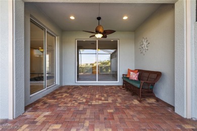 Experience the Florida lifestyle in this charming three-bedroom on Pelican Preserve Golf Club in Florida - for sale on GolfHomes.com, golf home, golf lot