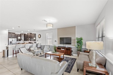 This VACATION HOME CHECKS ALL THE BOXES YOU'VE BEEN LOOKING FOR! on The Oasis Club at Champions Gate in Florida - for sale on GolfHomes.com, golf home, golf lot