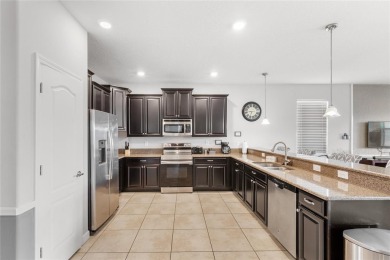 This VACATION HOME CHECKS ALL THE BOXES YOU'VE BEEN LOOKING FOR! on The Oasis Club at Champions Gate in Florida - for sale on GolfHomes.com, golf home, golf lot