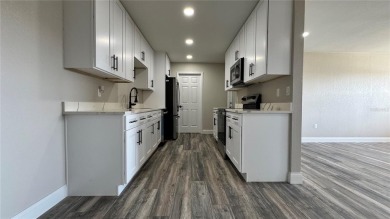 Welcome to this beautifully updated 3-bedroom, 1-bath on North Lakes Golf Course in Florida - for sale on GolfHomes.com, golf home, golf lot