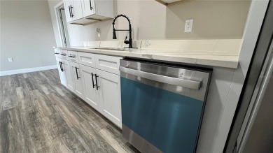 Welcome to this beautifully updated 3-bedroom, 1-bath on North Lakes Golf Course in Florida - for sale on GolfHomes.com, golf home, golf lot