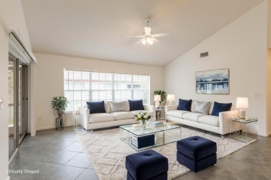 Vaulted ceilings and streaming natural light welcome you into on The Golf Club of Jupiter in Florida - for sale on GolfHomes.com, golf home, golf lot