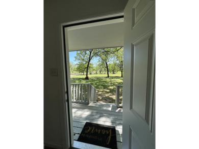 Begin your morning with a cup of coffee and take in the scenery on Vache-Grasse Country Club in Arkansas - for sale on GolfHomes.com, golf home, golf lot