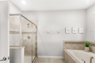This VACATION HOME CHECKS ALL THE BOXES YOU'VE BEEN LOOKING FOR! on The Oasis Club at Champions Gate in Florida - for sale on GolfHomes.com, golf home, golf lot