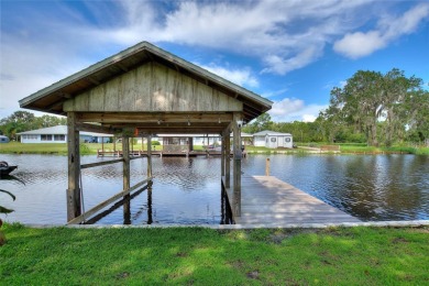 Don't Miss This Canal-Front Charmer!  Located in the desirable on Indian Lake Estates Golf and Country Club in Florida - for sale on GolfHomes.com, golf home, golf lot