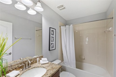 This VACATION HOME CHECKS ALL THE BOXES YOU'VE BEEN LOOKING FOR! on The Oasis Club at Champions Gate in Florida - for sale on GolfHomes.com, golf home, golf lot