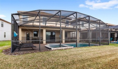 This VACATION HOME CHECKS ALL THE BOXES YOU'VE BEEN LOOKING FOR! on The Oasis Club at Champions Gate in Florida - for sale on GolfHomes.com, golf home, golf lot