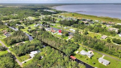 Don't Miss This Canal-Front Charmer!  Located in the desirable on Indian Lake Estates Golf and Country Club in Florida - for sale on GolfHomes.com, golf home, golf lot