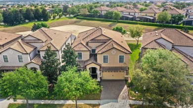 This VACATION HOME CHECKS ALL THE BOXES YOU'VE BEEN LOOKING FOR! on The Oasis Club at Champions Gate in Florida - for sale on GolfHomes.com, golf home, golf lot