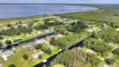 Don't Miss This Canal-Front Charmer!  Located in the desirable on Indian Lake Estates Golf and Country Club in Florida - for sale on GolfHomes.com, golf home, golf lot
