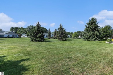 Welcome to easy living in the heart of Elk Rapids! This charming on Elk Rapids Golf Club in Michigan - for sale on GolfHomes.com, golf home, golf lot