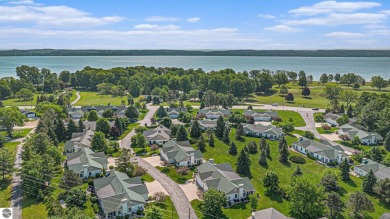 Welcome to easy living in the heart of Elk Rapids! This charming on Elk Rapids Golf Club in Michigan - for sale on GolfHomes.com, golf home, golf lot