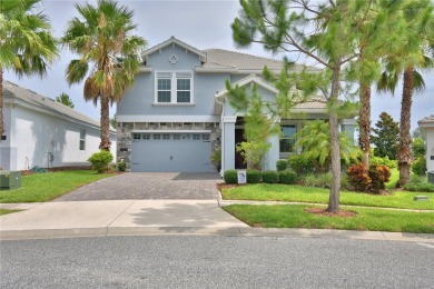 Located in the exclusive, gated community of ChampionsGate on The Oasis Club at Champions Gate in Florida - for sale on GolfHomes.com, golf home, golf lot
