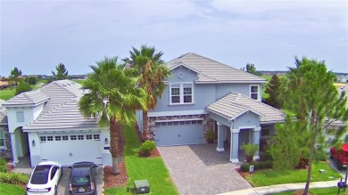 Located in the exclusive, gated community of ChampionsGate on The Oasis Club at Champions Gate in Florida - for sale on GolfHomes.com, golf home, golf lot