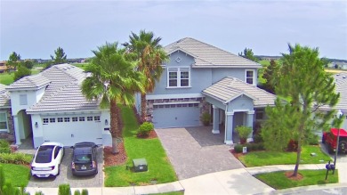 Located in the exclusive, gated community of ChampionsGate on The Oasis Club at Champions Gate in Florida - for sale on GolfHomes.com, golf home, golf lot
