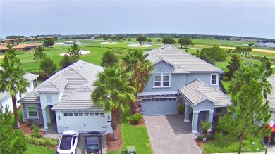Located in the exclusive, gated community of ChampionsGate on The Oasis Club at Champions Gate in Florida - for sale on GolfHomes.com, golf home, golf lot
