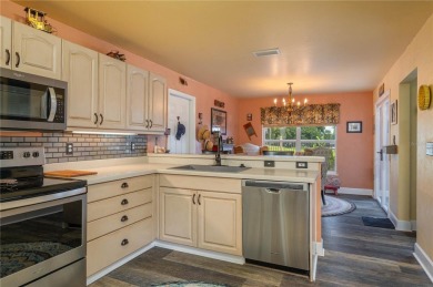 WATERFRONT HOME on CANAL TO BEAUTIFUL LAKE JUNE-- A Pool home on Placid Lakes Country Club in Florida - for sale on GolfHomes.com, golf home, golf lot